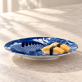 Blue-and-white koi and wave plate with two small tamago nigiri