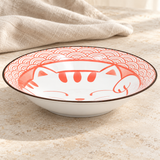 Cat design plate on a stone tabletop