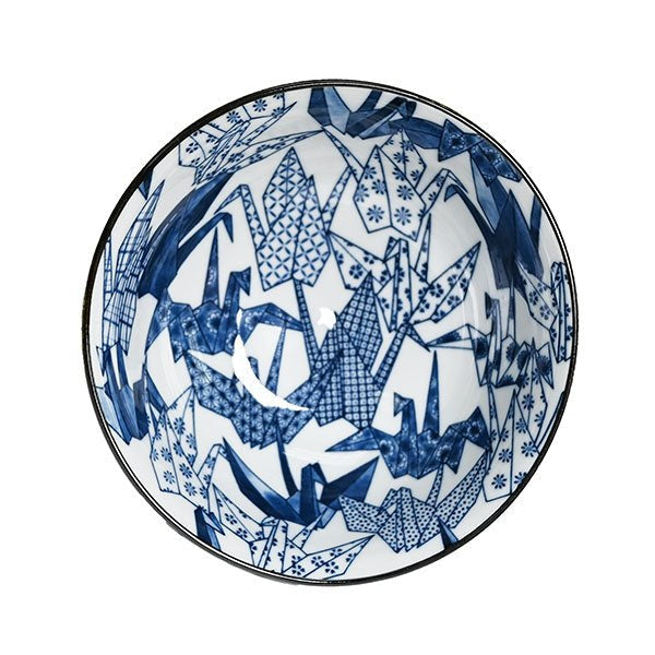 Overhead view of blue origami cranes with geometric and floral infill across the white bowl interior.