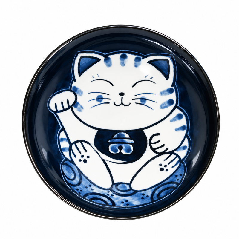 Overhead view of the dark-blue interior with a large smiling white-and-blue beckoning cat and raised paw.