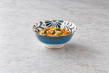 Blue mottled bowl with couscous and vegetables