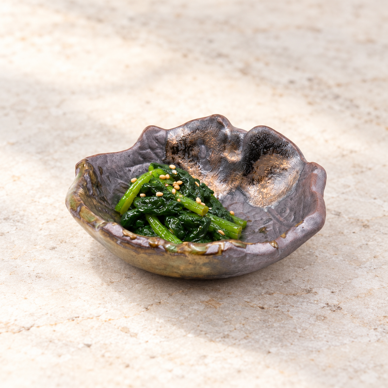 IM24-IK leaf-shaped ceramic dish with a small spinach accompaniment