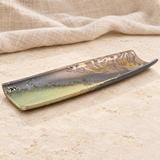 Decorative serving dish on a stone tabletop