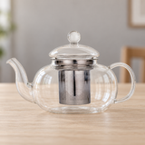 JN63G-1 glass teapot with metal infuser on a dining table