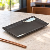 Empty JX289-E black ceramic sushi plate with its two pale-blue brush accents