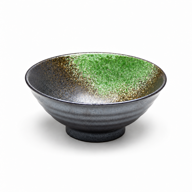 Wide flared black and green porcelain bowl with a speckled interior, horizontal exterior bands and a short foot.