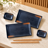 JX79-10 sushi plate and dish set with two chopstick pairs on a restaurant counter