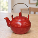 JYP1-4 red textured teapot with metal handle on a dining table