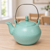 JYP1-5 celadon textured teapot with metal handle on a dining table