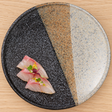 K210-OY three-tone mottled ceramic plate with sashimi on a wood table