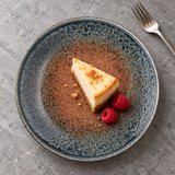 K210-SKC brown and blue-gray crackle-glaze ceramic plate with cheesecake and raspberries