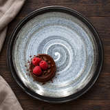 K29-F spiral ceramic deep plate with chocolate dessert and raspberries