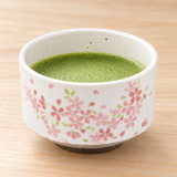 K537-SS cherry blossom bowl with prepared matcha on a table