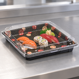 YP-4.0 10.5-inch Kamon sushi tray with a sushi assortment in a pickup setting