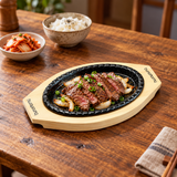 HYS01 iron steak plate with wooden base — sliced grilled beef serving suggestion