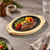 HYS02 iron steak plate with wooden base — steak and vegetables serving suggestion