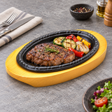 SM-MJ1 iron steak plate with wooden base — steak and vegetables serving suggestion