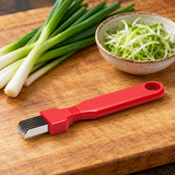 Red assorted-handle manual scallion shredder beside green onions