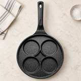 Four-well marble egg pan — kitchen preparation setting