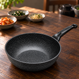 Marble-coated wok pan on a restaurant table