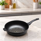 Diamond-coated wok pan on a restaurant counter