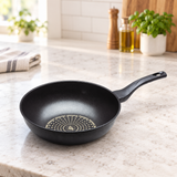 Diamond-coated wok pan on a restaurant counter