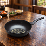 Diamond-coated wok pan on a restaurant table