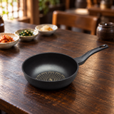 Diamond-coated wok pan on a restaurant table