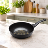 Diamond-coated wok pan on a restaurant counter