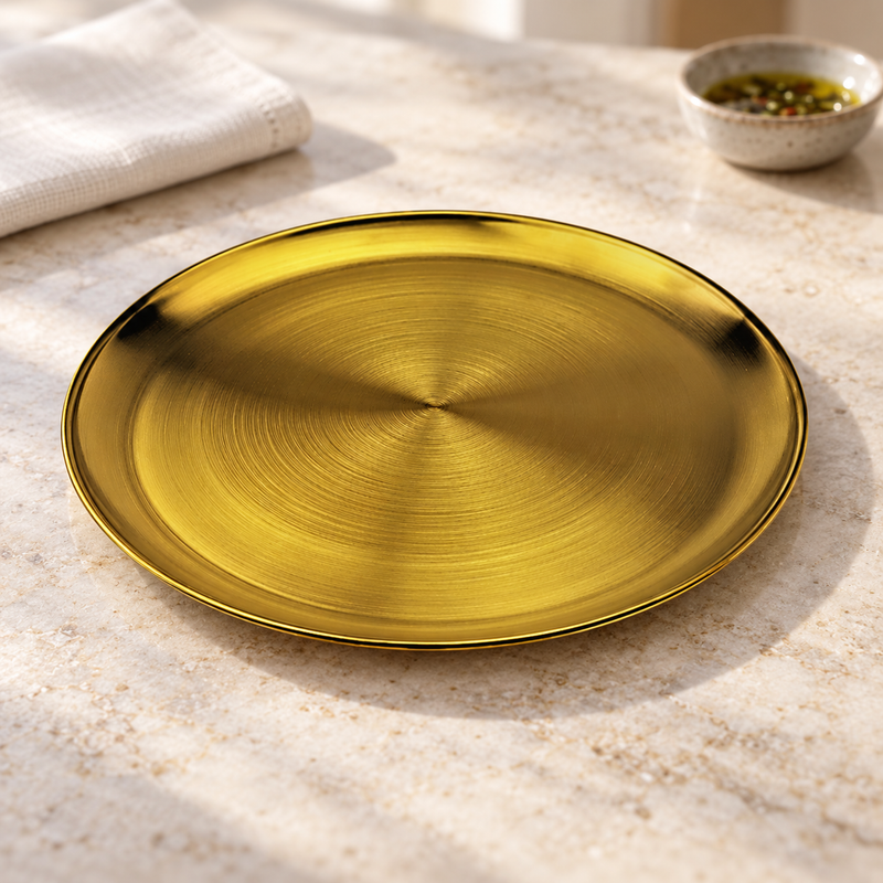 SSG-RP-11 sanded gold round plate on a pale restaurant counter