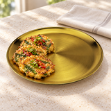 Gold sanded round plate with jeon at a restaurant service counter