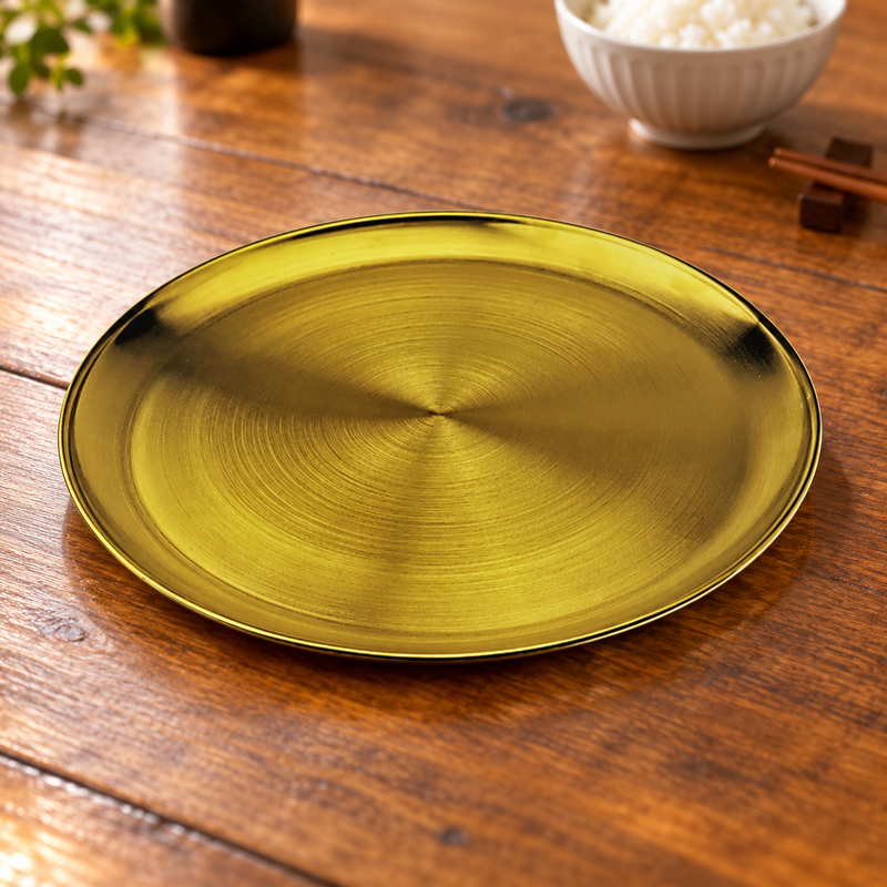 SSG-RP-13 sanded gold round serving plate on a restaurant table