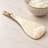 Autumn Grass rice paddle holding cooked rice