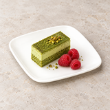 M001-38-03 white square plate with a small green cake slice and raspberries