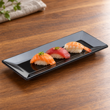 M0399-BK black rectangular melamine plate with a small nigiri course