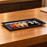 M1545-BK black rectangular melamine platter with a modest sushi arrangement