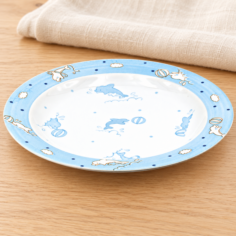 Blue dolphin design plate in a natural tabletop setting
