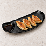 10-7/8*4-1 Melamine Oval Plate W/ Divider, Black. Serving suggestion.