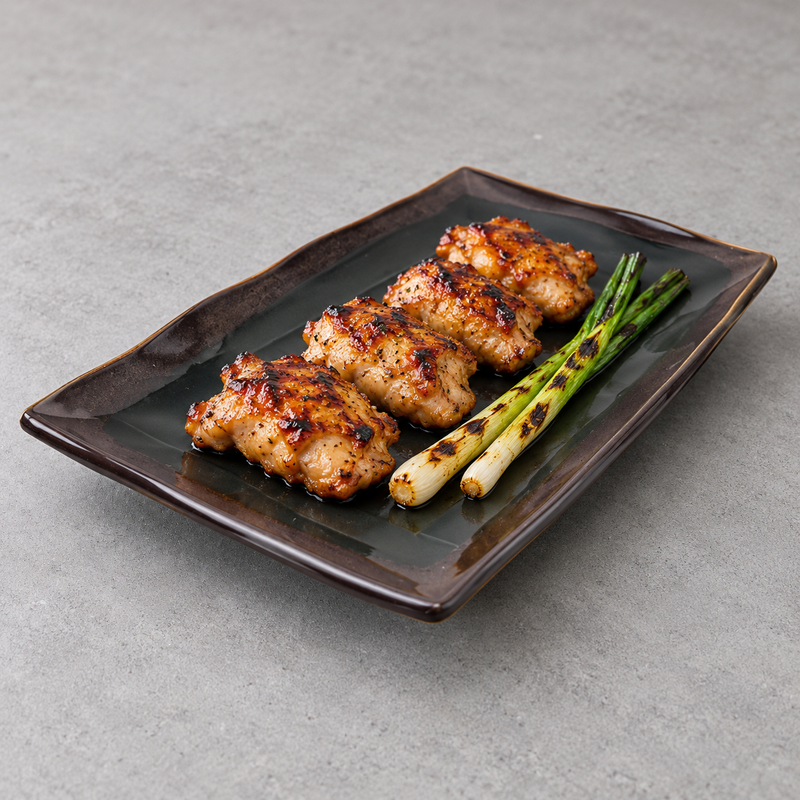 511-TM textured black and brown rectangular plate with grilled chicken and vegetables