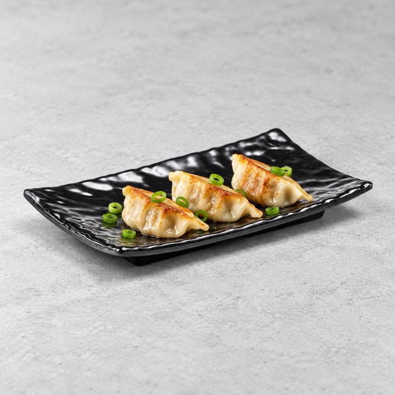 Dumplings arranged on the YG-538MB black melamine plate