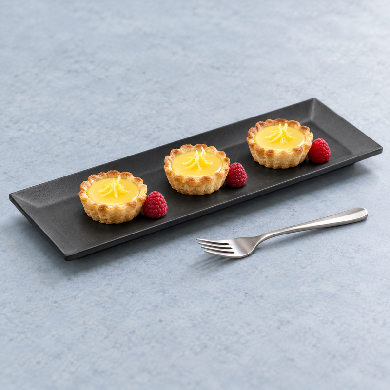 YG-5212MB matte black rectangular platter with three small lemon tarts and raspberries