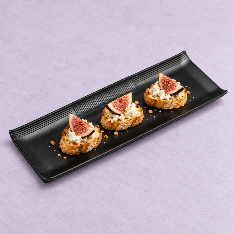 YG-513MB matte black platter presenting small desserts with fruit