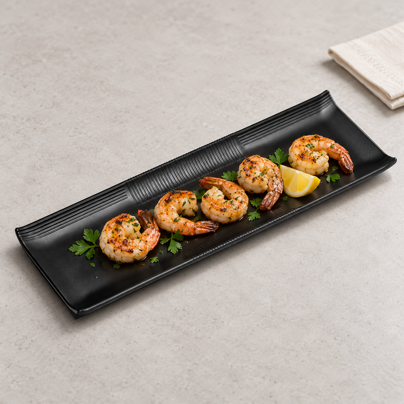 YG-513MB matte black platter presenting a row of shrimp appetizers