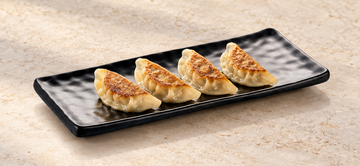 YG-5411MB: Melamine Rectangular Ripple Platter 12-3/4", Matte Black. Restaurant serving context