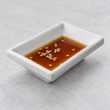 Melamine Rectangular Sauce Dish 3-3/8", White. Serving suggestion.