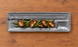 Dark brush-pattern ceramic platter with mushrooms and green beans