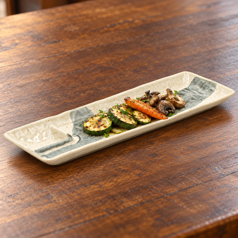 Beige and blue-gray ceramic platter with grilled vegetables