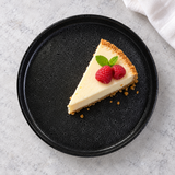 MT265-BK black round plate with cheesecake and raspberries