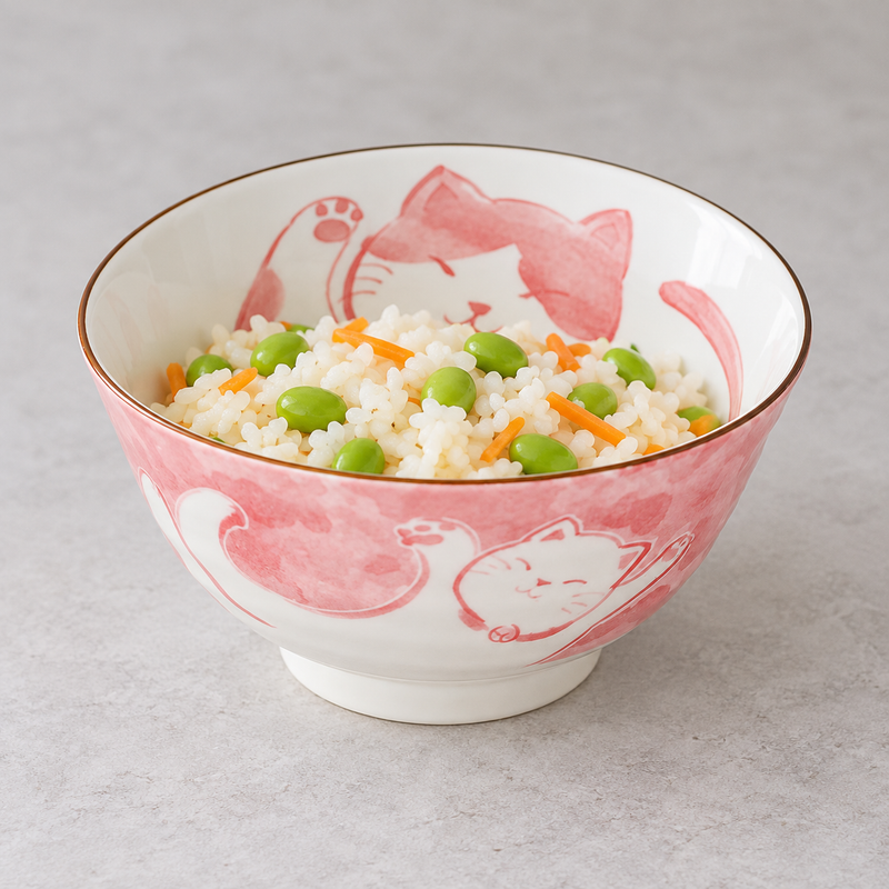 MT55-MCR cat bowl holding white rice with green edamame-shaped beans and carrot strips; no utensil is shown.