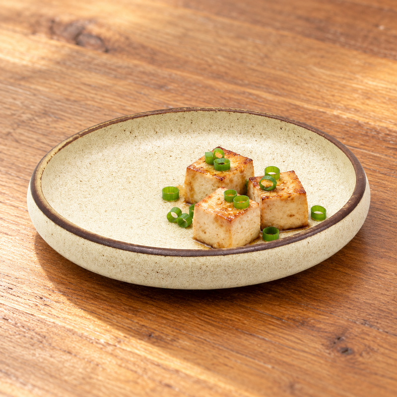 Glazed tofu with scallions on the MT57-WH beige speckled deep plate